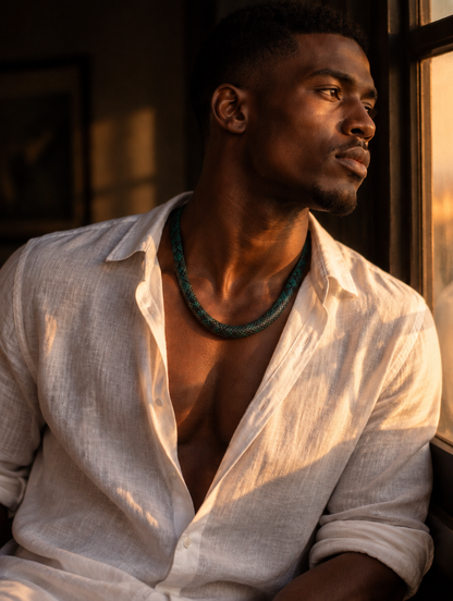 Man wearing the Vexa snake print necklace in Emerald Green